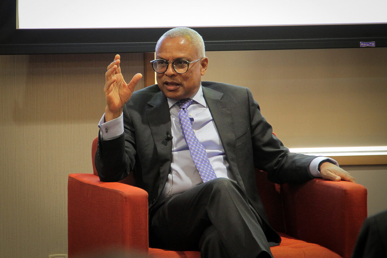 President Neves sitting in a red chair during his public talk at MIT